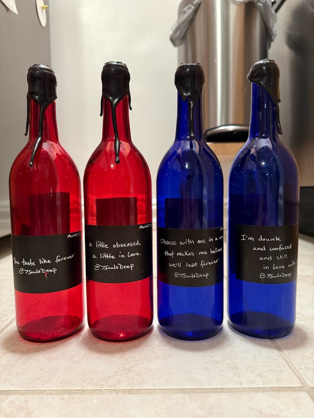 Decorative Red and Blue Glass Wine Bottle Set - Handwritten Label Accents